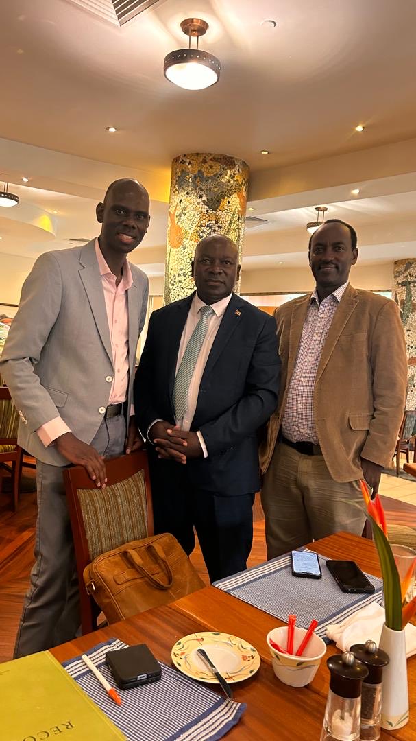 Dr. Cleophus Mugenyi with colleagues