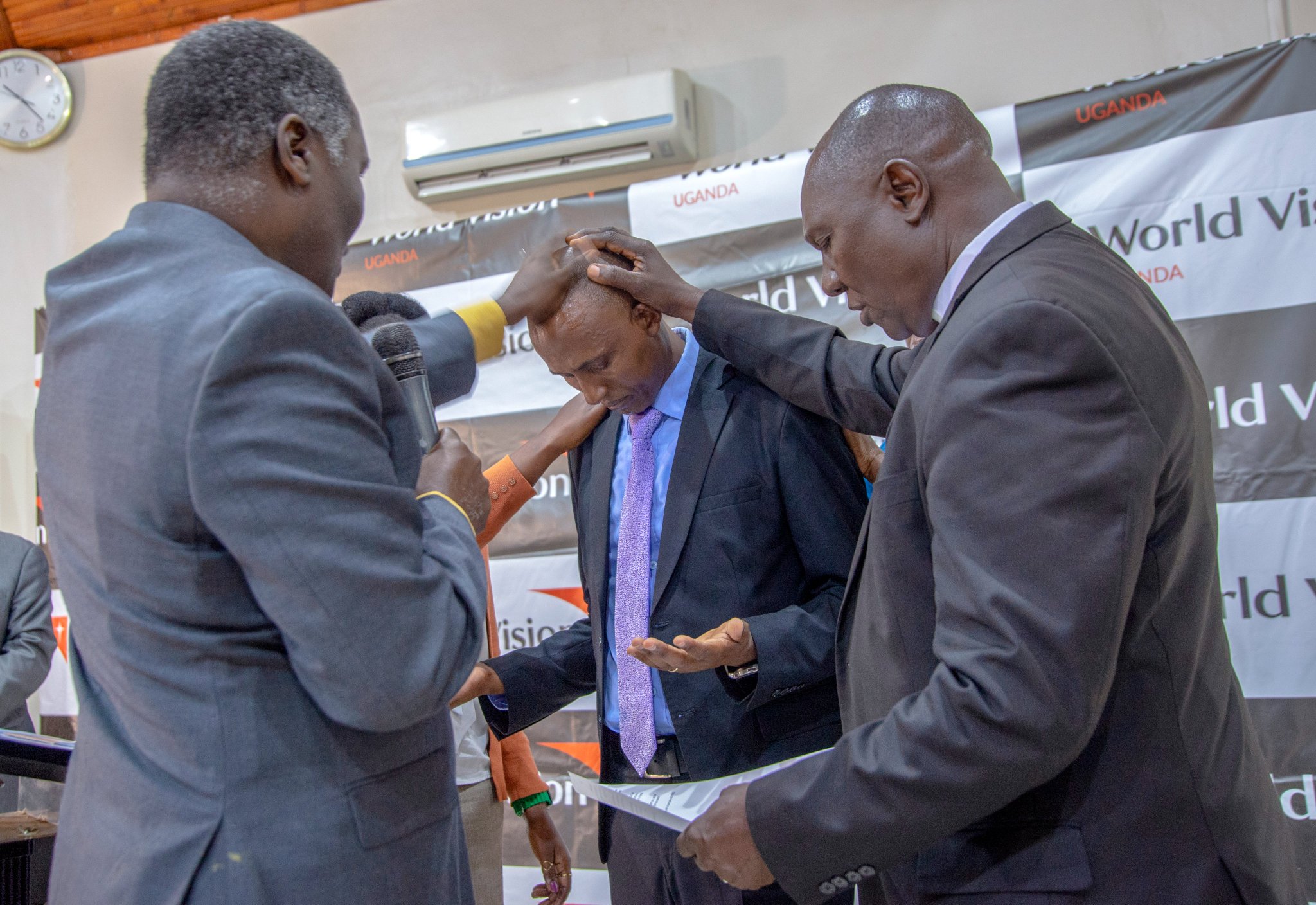 Prosper Mubangizi with World Vision partners